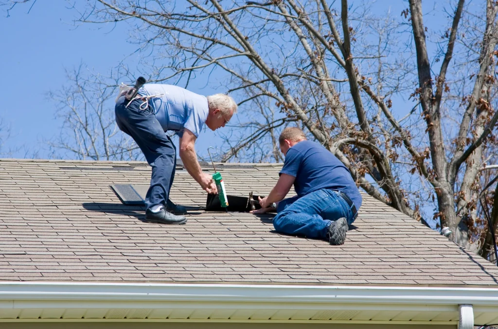 Anaheim roofers working on a residential roof during a contractor assessment.
