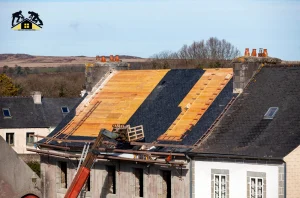 Anaheim roofers replacing damaged roofing materials on a home under full roof restoration.