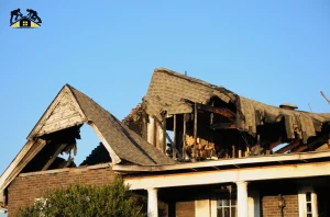 Anaheim roofers repairing severe roof damage on a home after a storm.